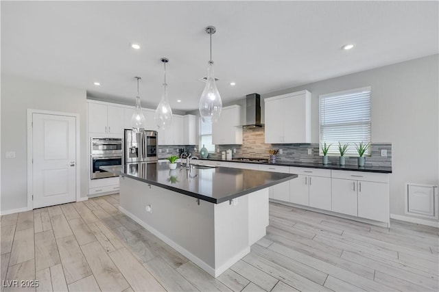 1609 Dream Canyon Ave, North Las Vegas, NV 89084 - kitchen with wall chimney exhaust hood, dark countertops, backsplash, and stainless steel appliances