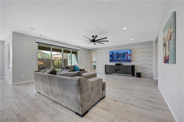 1609 Dream Canyon Ave, North Las Vegas, NV 89084 - living room with recessed lighting, a ceiling fan, light wood-type flooring, baseboards, and a fireplace
