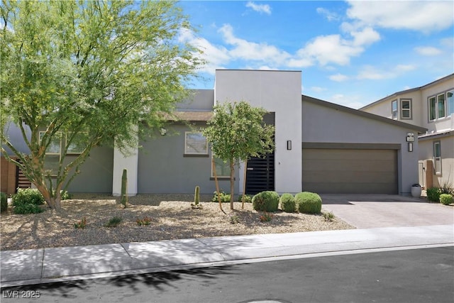 1609 Dream Canyon Ave, North Las Vegas, NV 89084 - contemporary home with an attached garage, concrete driveway, and stucco siding