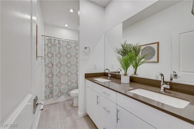 1609 Dream Canyon Ave, North Las Vegas, NV 89084 - full bathroom with a sink, recessed lighting, double vanity, and toilet