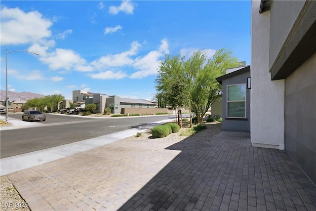 1609 Dream Canyon Ave, North Las Vegas, NV 89084 - view of road with a residential view, sidewalks, and street lighting