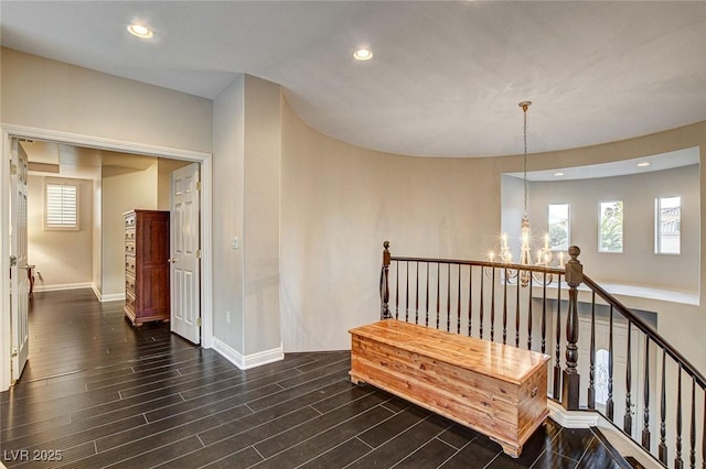 hall with recessed lighting, baseboards, and dark wood-style floors