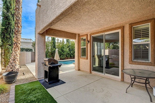 view of patio / terrace featuring a fenced backyard and a grill