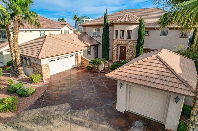view of front of home with a tile roof, stone siding, and stucco siding