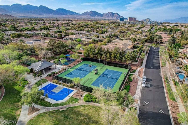 birds eye view of property featuring a mountain view and a residential view