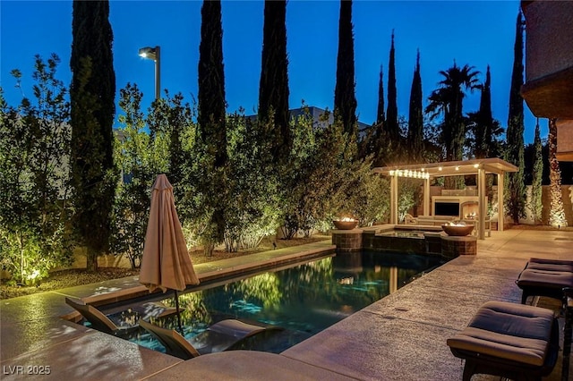 view of pool featuring a patio, a pool with connected hot tub, and a pergola