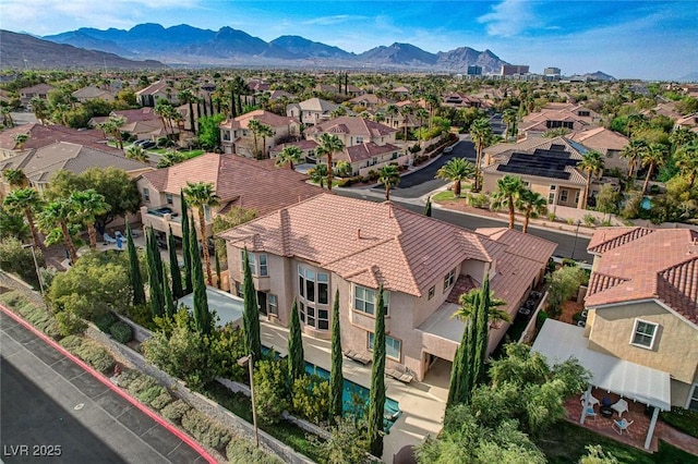 drone / aerial view with a residential view and a mountain view