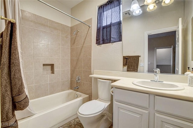 full bath with vanity, shower / bathing tub combination, toilet, and visible vents