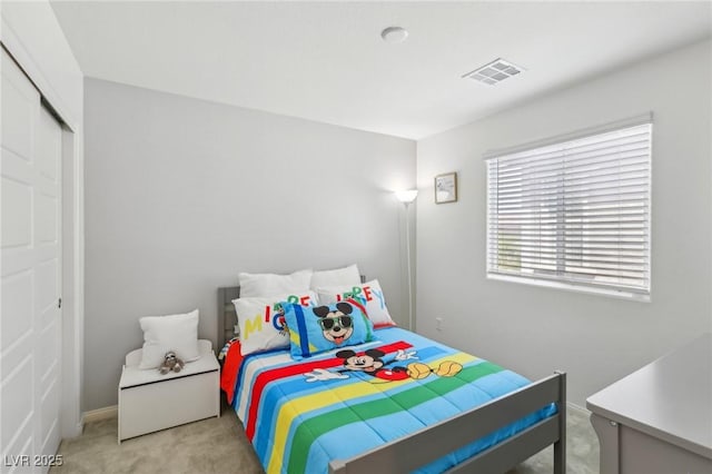 carpeted bedroom featuring visible vents and baseboards