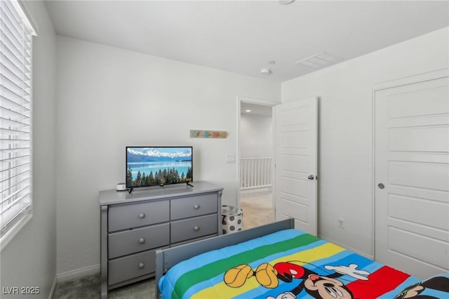 bedroom featuring baseboards and carpet flooring