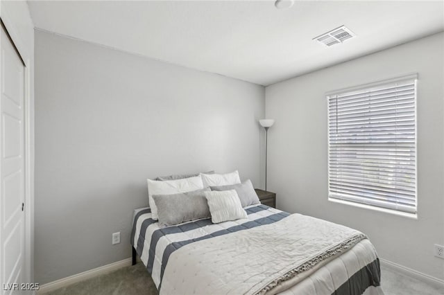 bedroom featuring visible vents, baseboards, and carpet flooring
