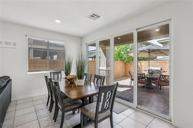 dining room featuring light tile patterned floors, baseboards, visible vents, and recessed lighting
