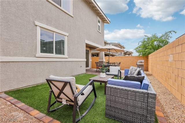 view of yard featuring a fenced backyard, an outdoor living space, a patio, and outdoor dining area
