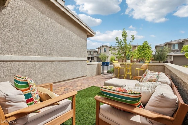 balcony featuring a residential view, a patio, and outdoor lounge area