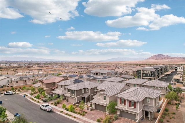 bird's eye view with a residential view and a mountain view