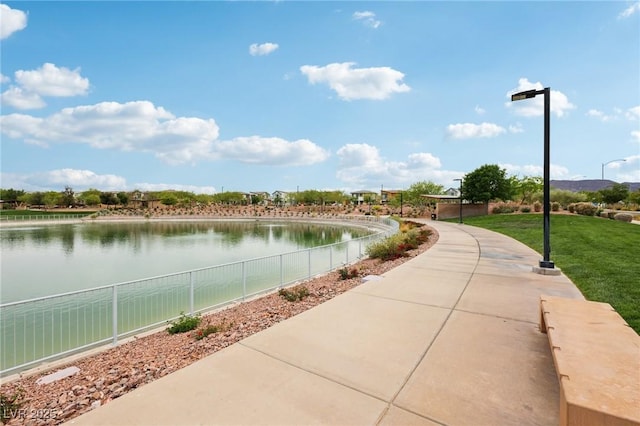 property view of water featuring fence