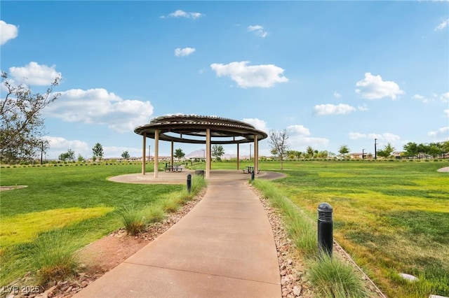 surrounding community with a gazebo and a lawn