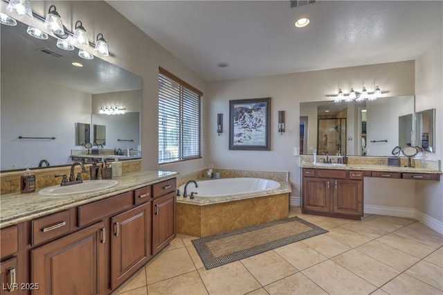 79 Rezzonico Dr, Henderson, NV 89011 - bathroom with a shower stall, a bath, tile patterned floors, and two vanities