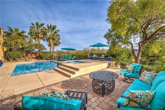 79 Rezzonico Dr, Henderson, NV 89011 - view of pool with a patio area, an in-ground hot tub, an outdoor living space, and a fenced backyard