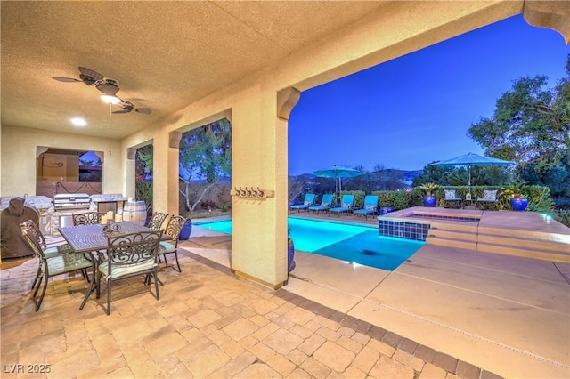 79 Rezzonico Dr, Henderson, NV 89011 - view of pool featuring an in-ground hot tub, a patio, ceiling fan, outdoor dining area, and a fenced backyard
