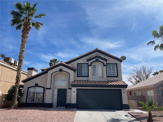 9139 Scallop Reef Ave, Las Vegas, NV 89147 - mediterranean / spanish-style house with stucco siding, a chimney, concrete driveway, an attached garage, and a tile roof
