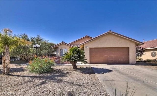 388 Coronado Dr, Henderson, NV 89015 - view of front of property featuring concrete driveway, stucco siding, and a garage