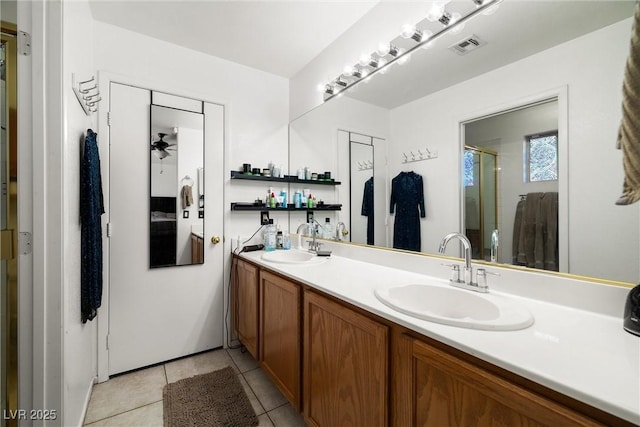 388 Coronado Dr, Henderson, NV 89015 - bathroom featuring double vanity, a stall shower, tile patterned floors, and ceiling fan