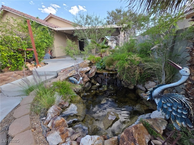 388 Coronado Dr, Henderson, NV 89015 - view of yard with a garden pond