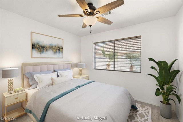 388 Coronado Dr, Henderson, NV 89015 - bedroom with wood finished floors, baseboards, and ceiling fan