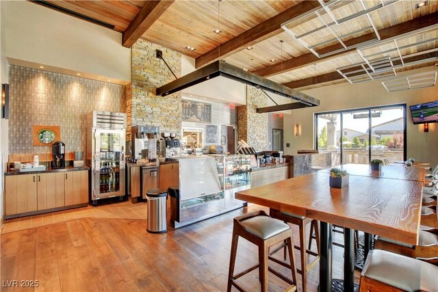 9993 Birch Knoll Ave, Las Vegas, NV 89166 - dining area featuring wood ceiling with exposed beams and light wood-style floors