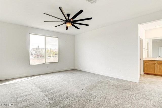 9993 Birch Knoll Ave, Las Vegas, NV 89166 - unfurnished room with light carpet, ceiling fan, baseboards, and a sink