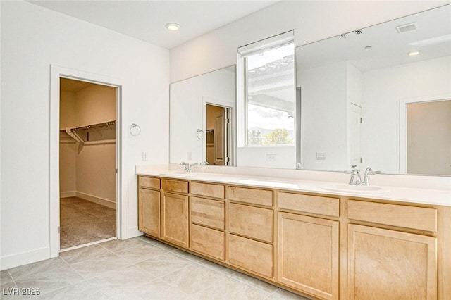 9993 Birch Knoll Ave, Las Vegas, NV 89166 - bathroom featuring double vanity and a walk in closet