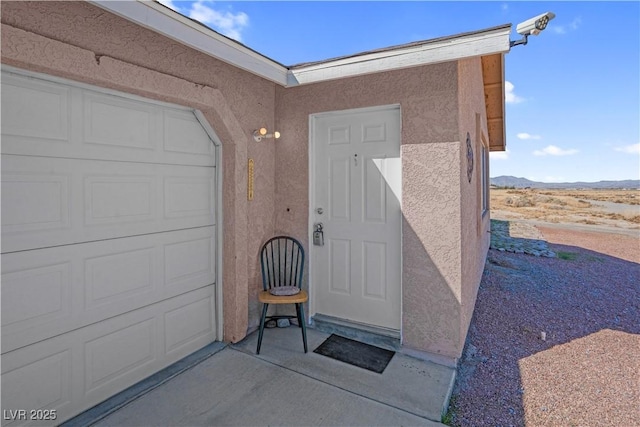 2831 Goldrush St, Pahrump, NV 89048 - doorway to property featuring stucco siding and a mountain view