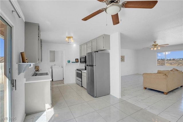 2831 Goldrush St, Pahrump, NV 89048 - kitchen with light countertops, ceiling fan, appliances with stainless steel finishes, a sink, and gray cabinetry