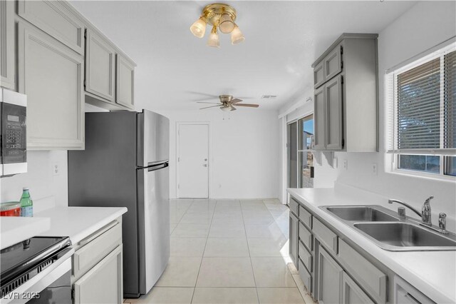 2831 Goldrush St, Pahrump, NV 89048 - kitchen featuring ceiling fan, a sink, and light countertops