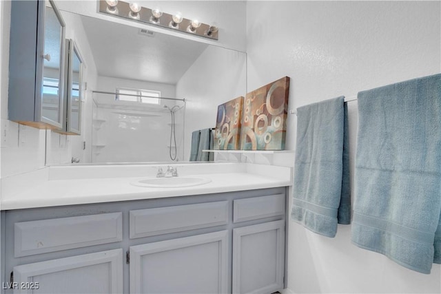 2831 Goldrush St, Pahrump, NV 89048 - full bathroom with vanity, visible vents, and walk in shower