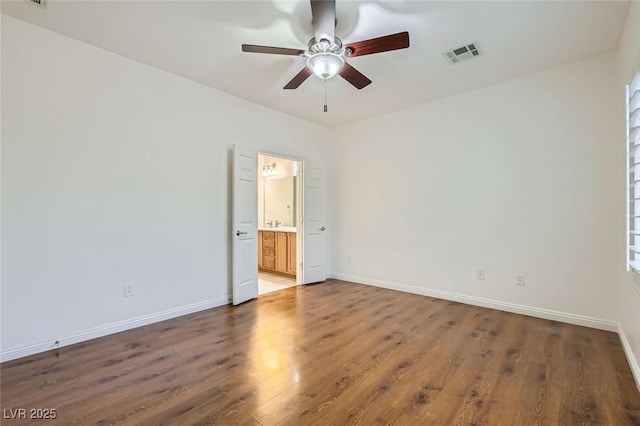 2409 Garganey Ave, North Las Vegas, NV 89084 - spare room featuring ceiling fan, wood finished floors, and baseboards