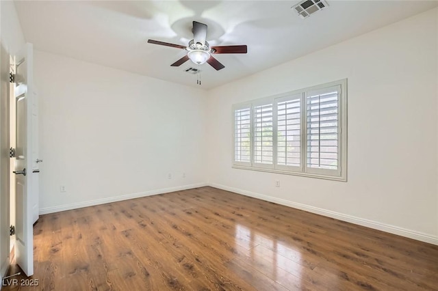 2409 Garganey Ave, North Las Vegas, NV 89084 - empty room featuring a ceiling fan, wood finished floors, and baseboards
