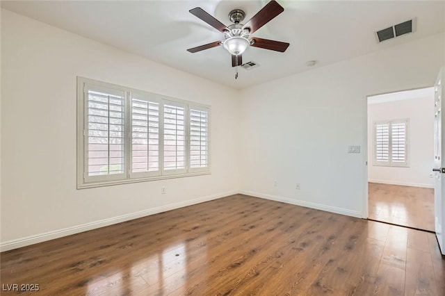 2409 Garganey Ave, North Las Vegas, NV 89084 - empty room with wood finished floors, ceiling fan, and baseboards