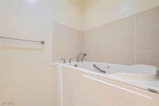 2409 Garganey Ave, North Las Vegas, NV 89084 - bathroom with a garden tub and tile walls