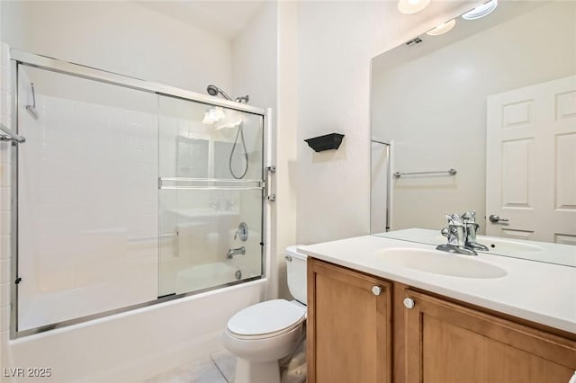 2409 Garganey Ave, North Las Vegas, NV 89084 - full bath featuring toilet, vanity, shower / bath combination with glass door, and tile patterned flooring