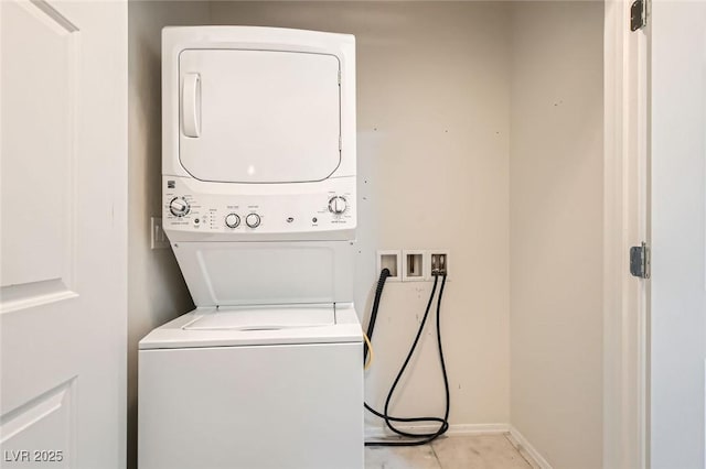 2409 Garganey Ave, North Las Vegas, NV 89084 - clothes washing area with stacked washing machine and dryer and baseboards
