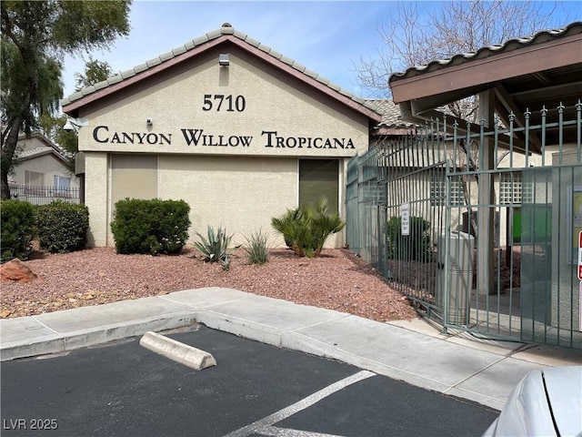 5710 E Tropicana Ave Unit 2033, Las Vegas, NV 89122 - community / neighborhood sign featuring fence