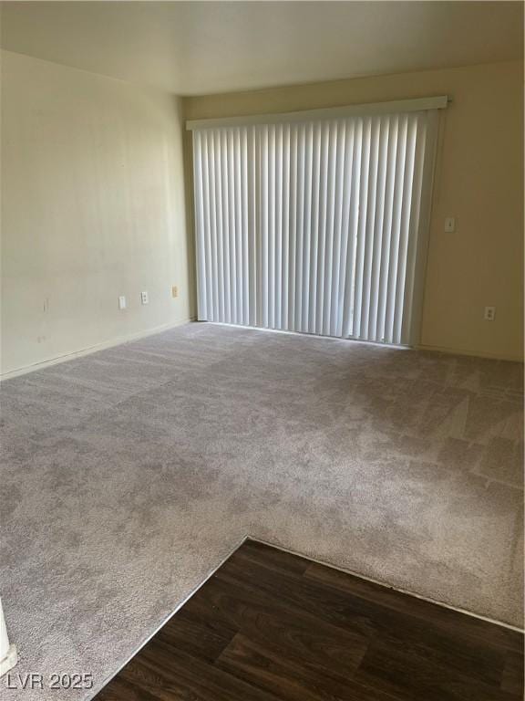 5710 E Tropicana Ave Unit 2033, Las Vegas, NV 89122 - unfurnished room with dark colored carpet