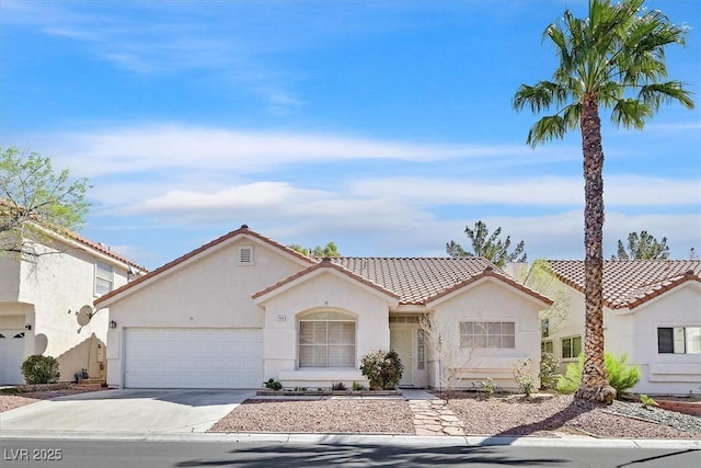 4932 Forest Oaks Dr, Las Vegas, NV 89149 - mediterranean / spanish home featuring stucco siding, a garage, driveway, and a tile roof