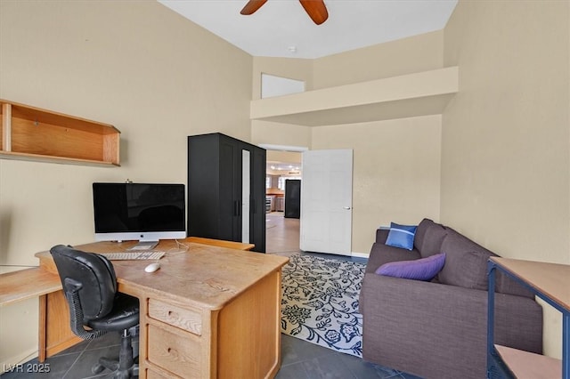 4932 Forest Oaks Dr, Las Vegas, NV 89149 - office featuring ceiling fan, dark tile patterned floors, and high vaulted ceiling