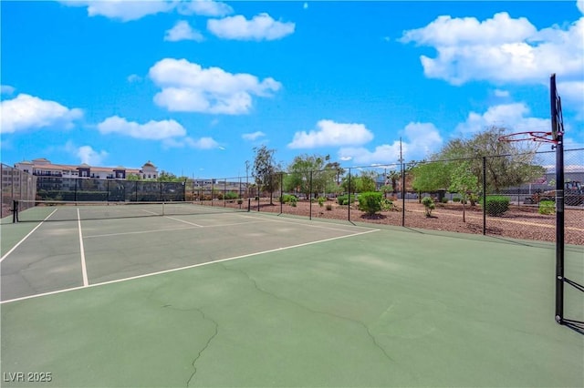 view of tennis court with fence