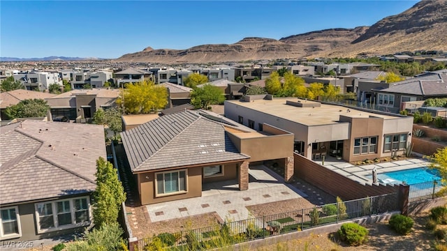 10348 Bressana Dr, Las Vegas, NV 89135 - aerial perspective of suburban area with a mountainous background and a pool area