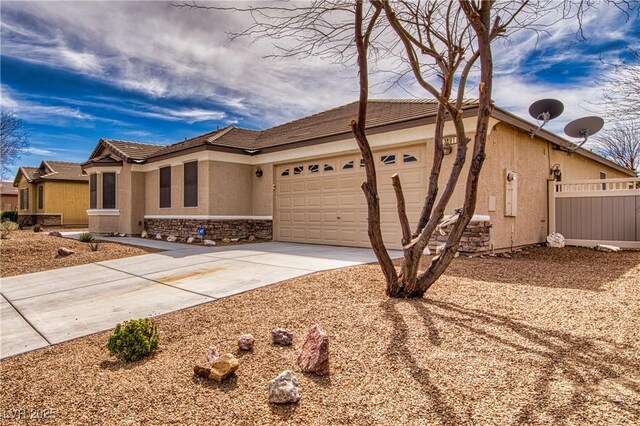 3891 Sedgwick, Pahrump, NV 89061 - single story home featuring stone siding, fence, a garage, stucco siding, and driveway