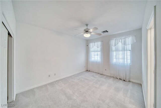 3891 Sedgwick, Pahrump, NV 89061 - spare room with light carpet, baseboards, visible vents, and ceiling fan